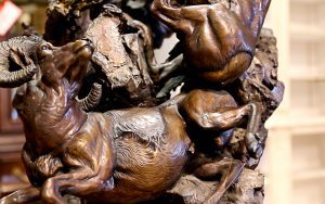 A close up of some bronze statues on the ground