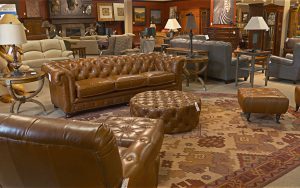 A living room filled with furniture and a fireplace.